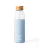 Glass Reusable Water Bottle with Blue Silicone Sleeve by Born Nouli