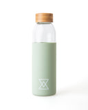 Glass Water Bottle with Green Silicone Sleeve by Born Nouli